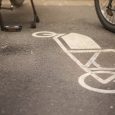 bicycles parking at cargo bike parking slot marked with painted symbol on asphalt